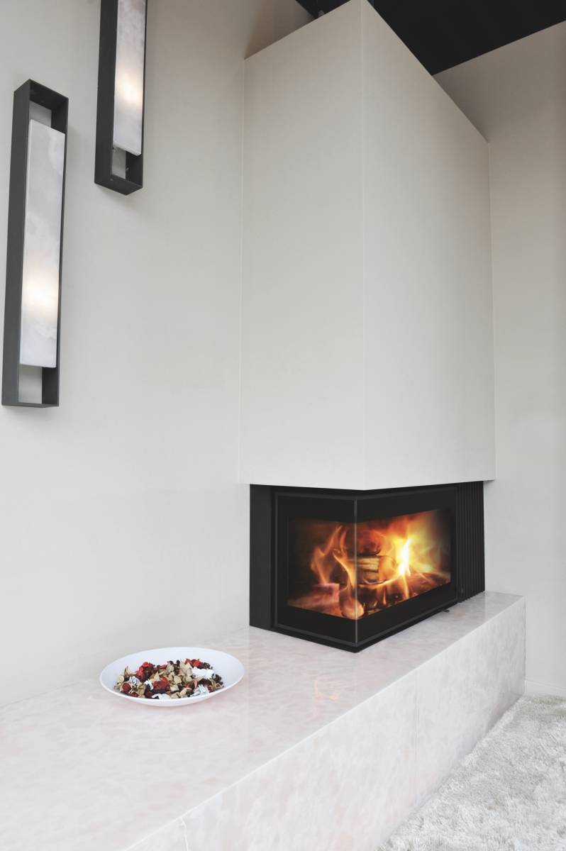 Cheminée en angle avec banquette en granit à Langon